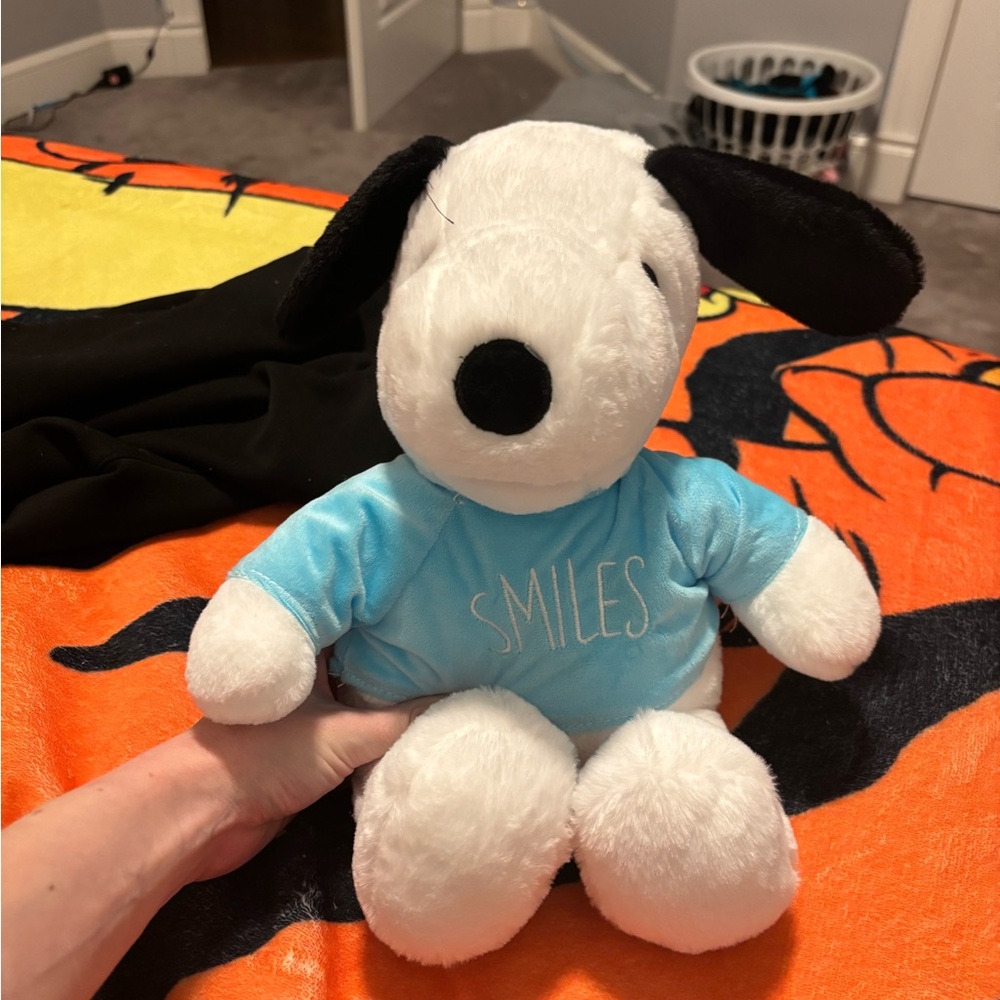 Charming Plush Dog with Black Ears and Blue Shirt